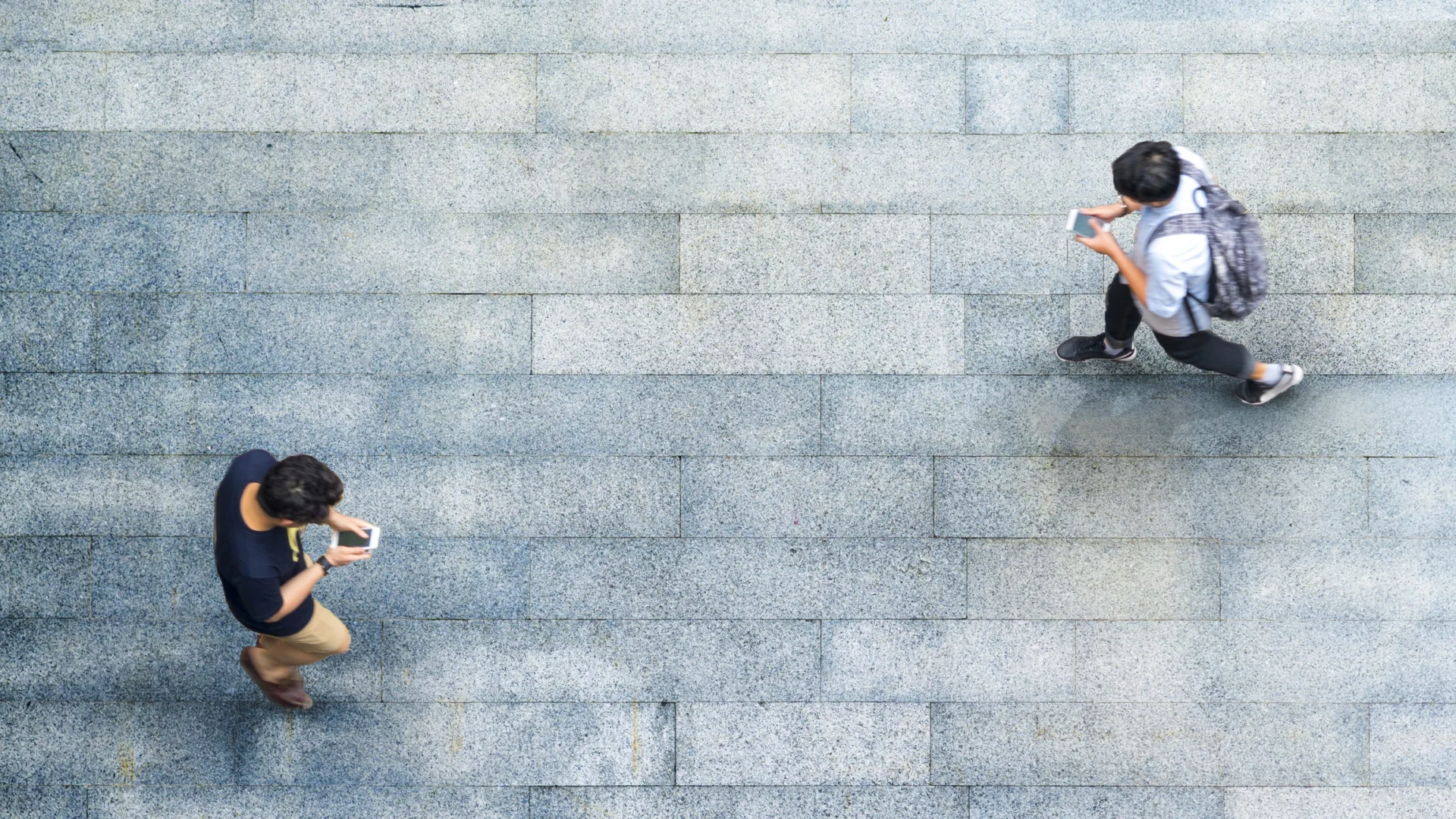 People walking using phones
